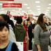 A Target employee directs shoppers to  the check out line on Thursday. Daniel Brenner I AnnArbor.com